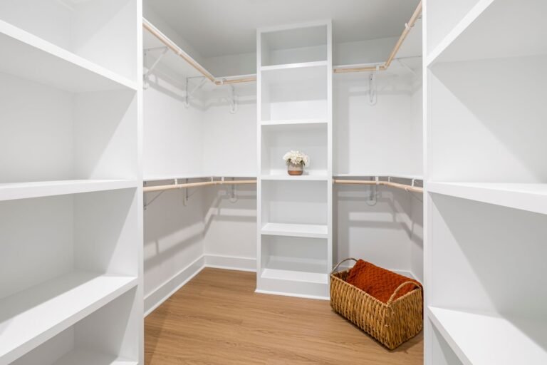 Bright walk-in closet with open shelving